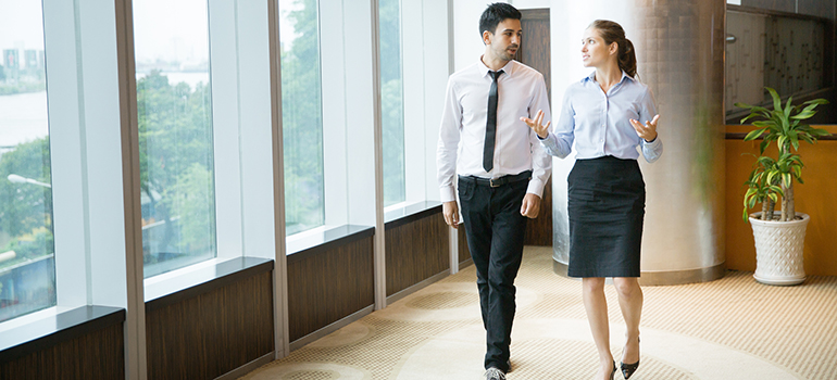 Business People Walking in Office