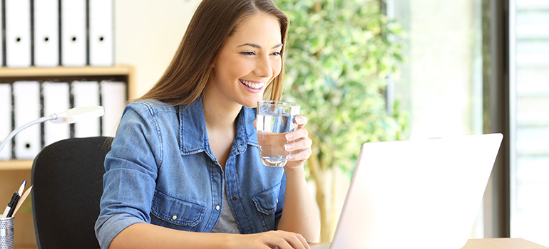 Entrepreneur working and drinking water